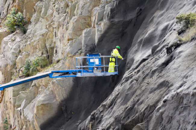 Worker,In,Crane,Vehicle,Sprayed,Concrete,,,Shotcrete,on,The,Highway